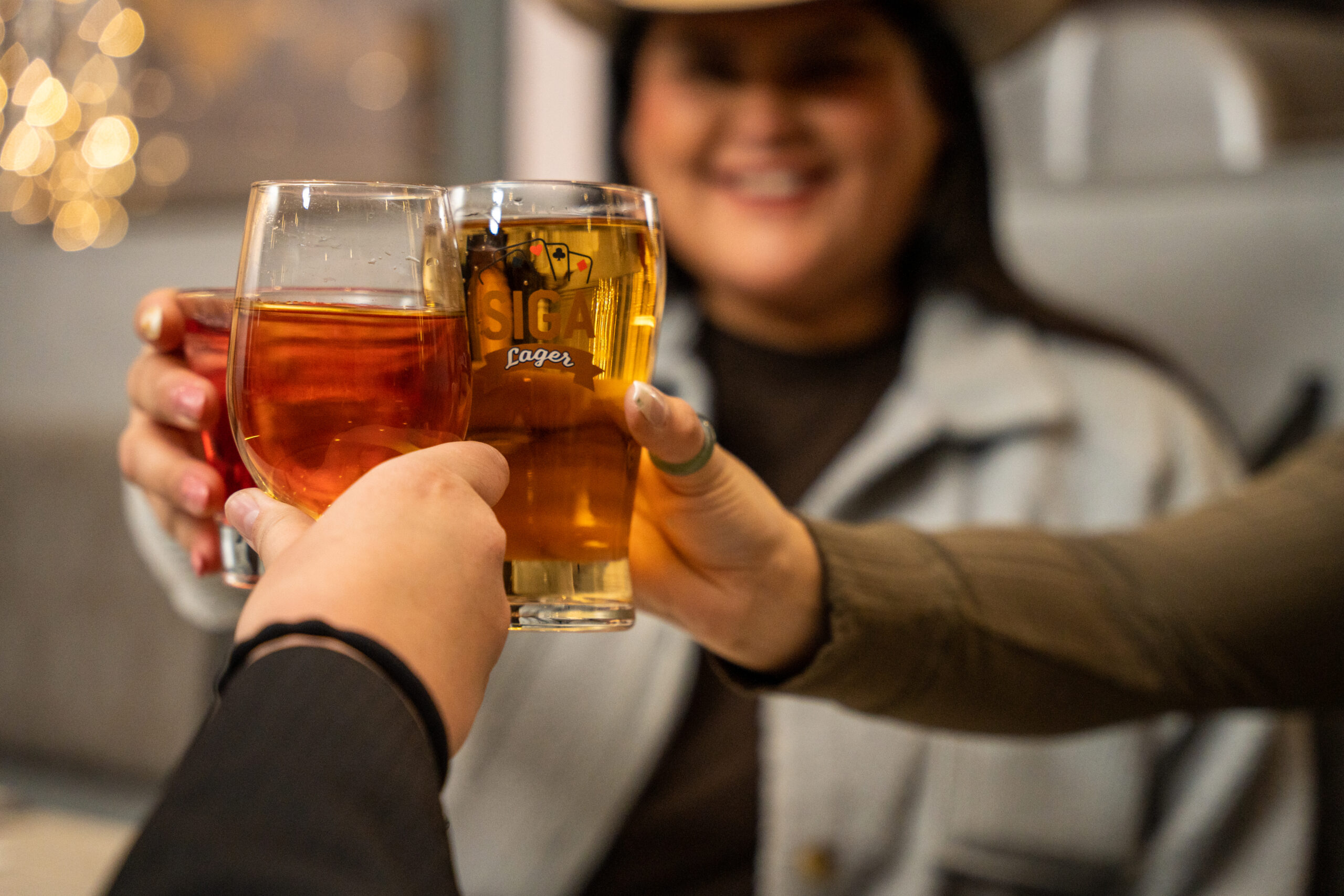 group of people celebrating with beer