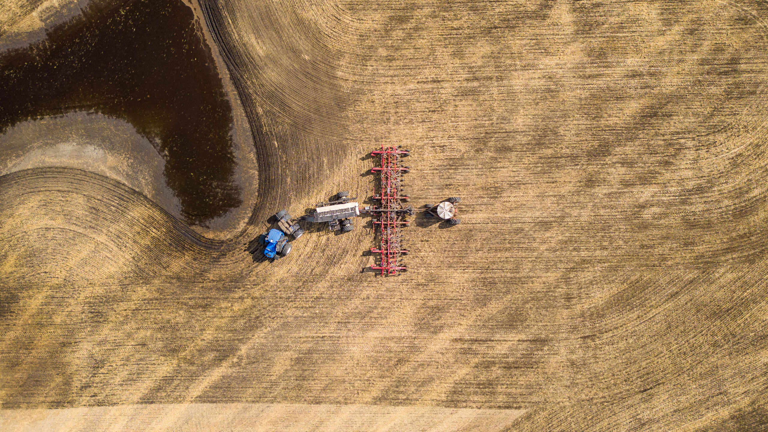 aerial photo of tractor on field